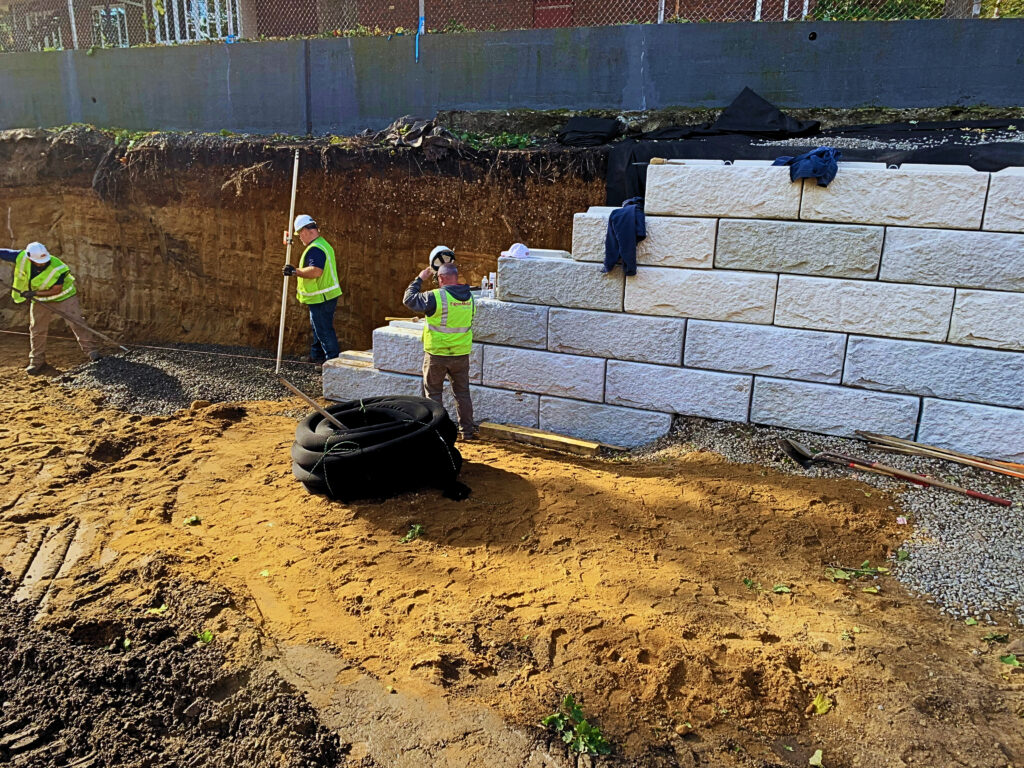 retaining wall construction in new commercial lot development eastern mass