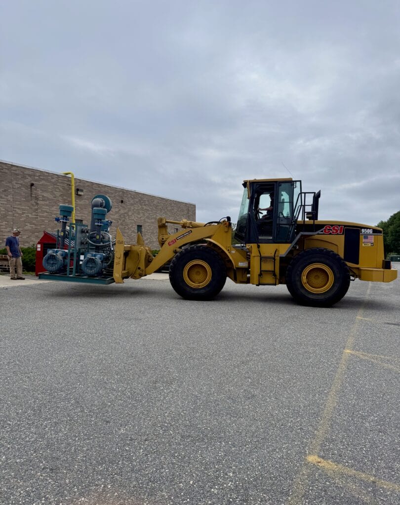 sub-slab depressurization system loaded on front end loader getting ready for transport and installation