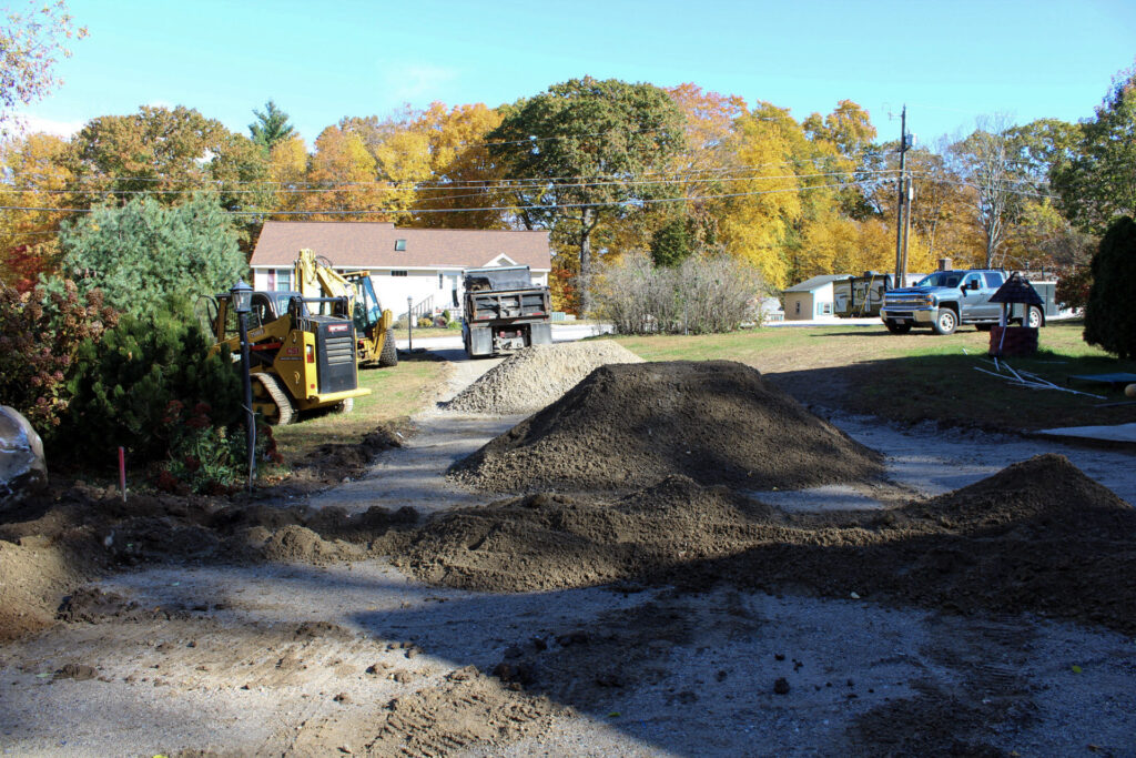 new driveway being installed, prep for new area, with materials